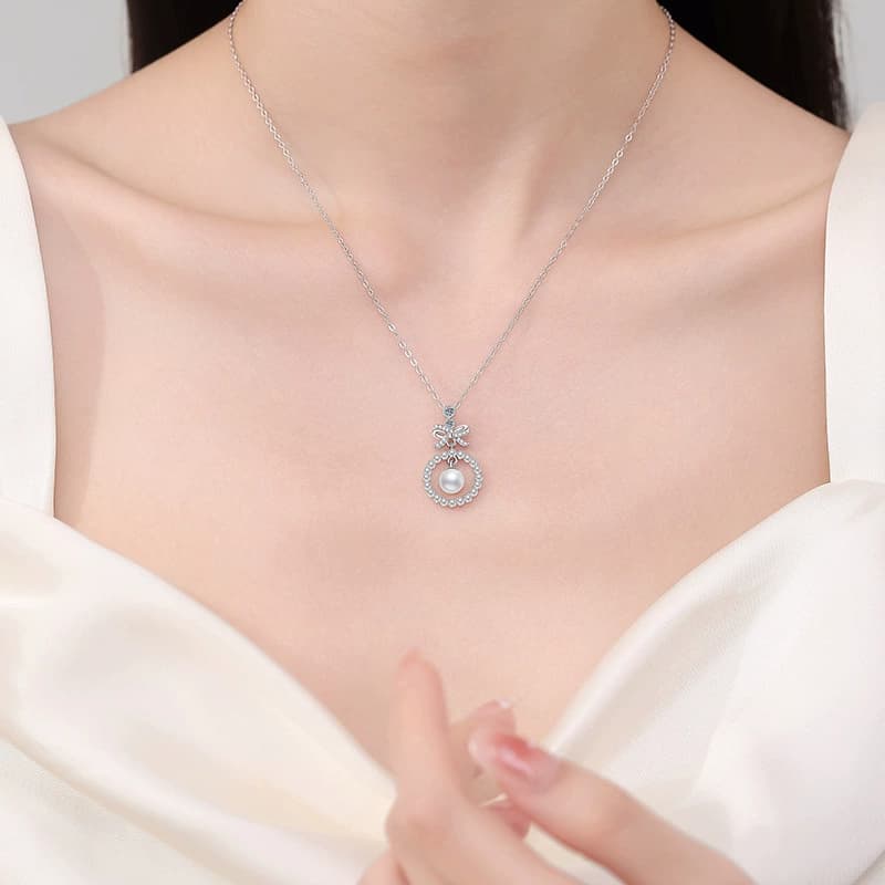 Luna Series · Bow and Pearl Halo Pendant Necklace — Sterling Silver — image 2