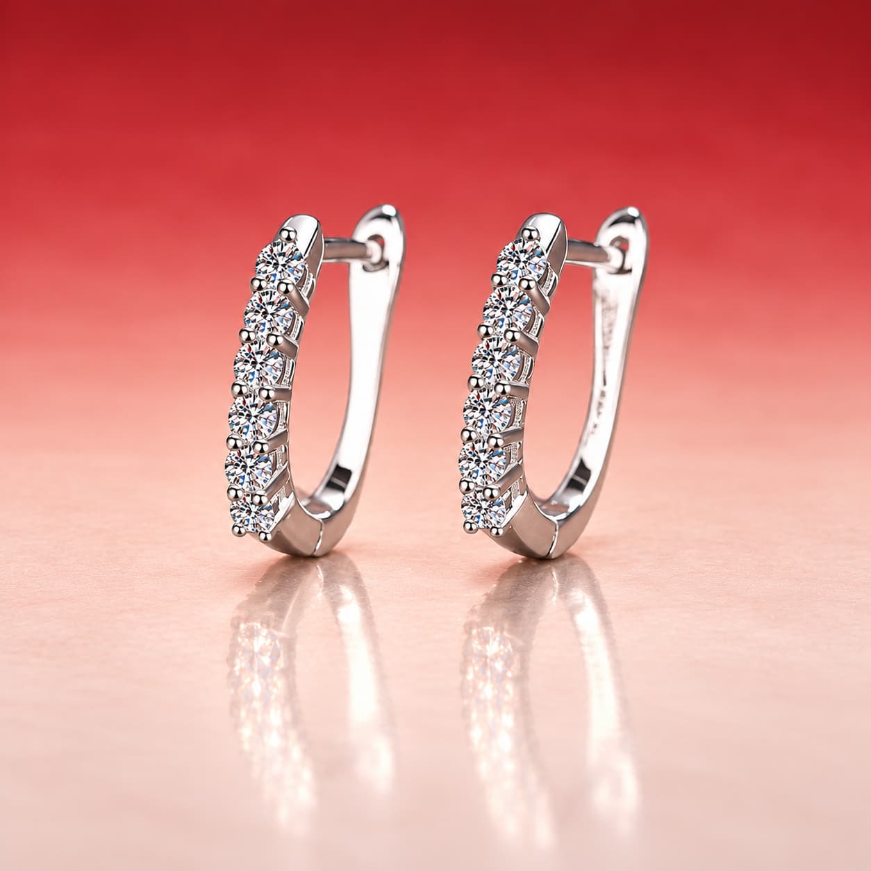 Luna Series · Graduated-Stone Huggie Earrings — Sterling Silver — image 1