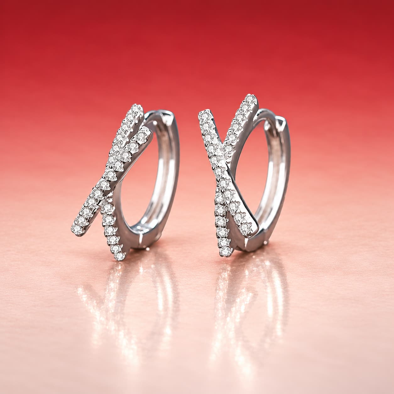 Luna Series · Crossed Pavé Huggie Earrings — Sterling Silver — image 1